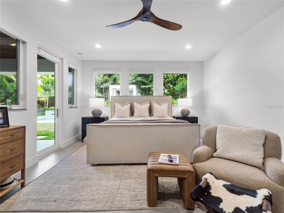 Master suite has an door leading to the covered patio and pool