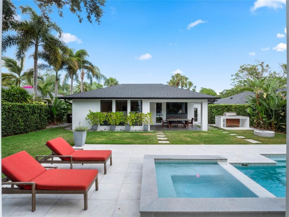 View of the backyard oasis and back of the home