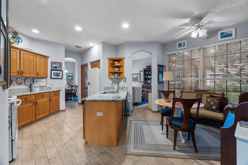 Kitchen at left, breakfast nook at right.