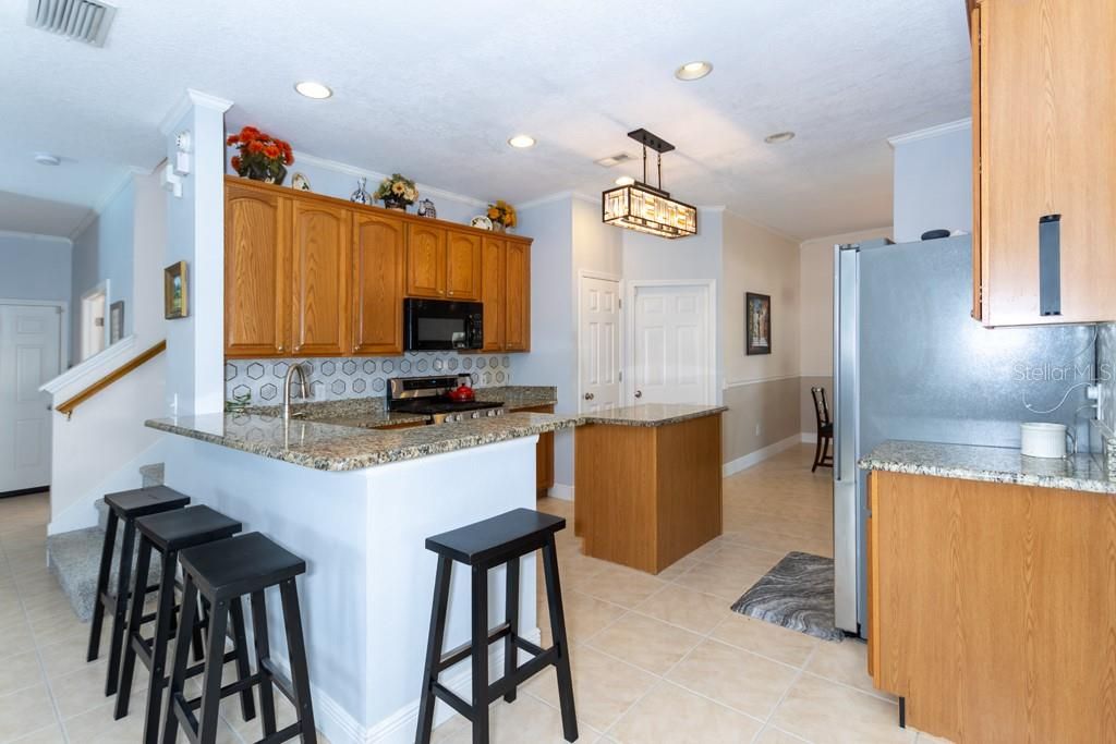 Kitchen with 42" Cabinets, Granite Countertops, Pantry, Island, Gas Range