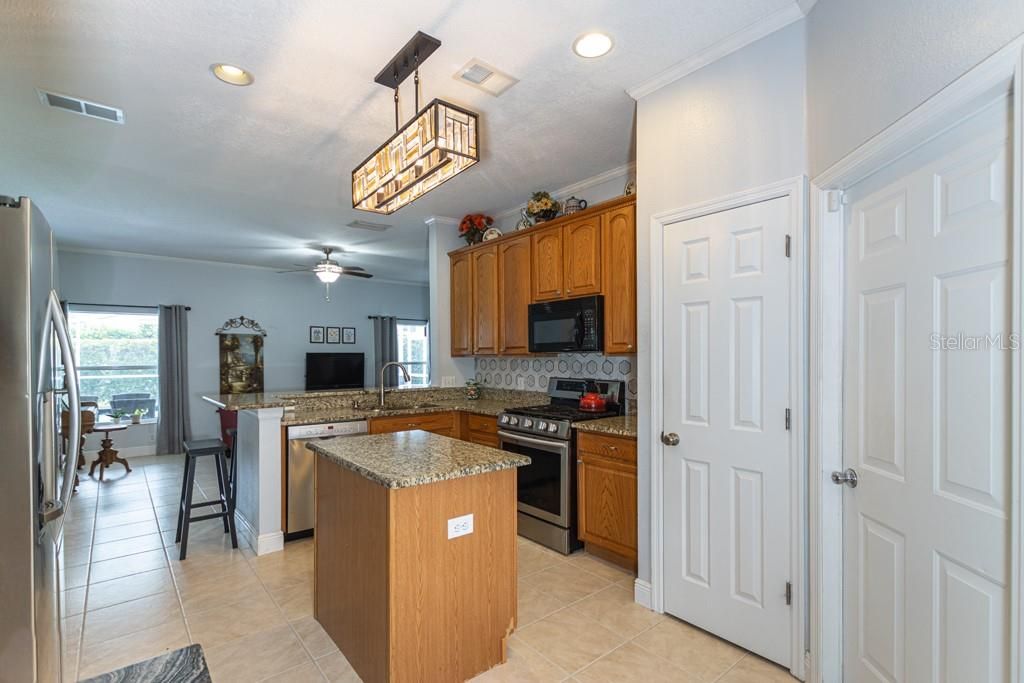 Kitchen with 42" Cabinets, Granite Countertops, Pantry, Island, Gas Range