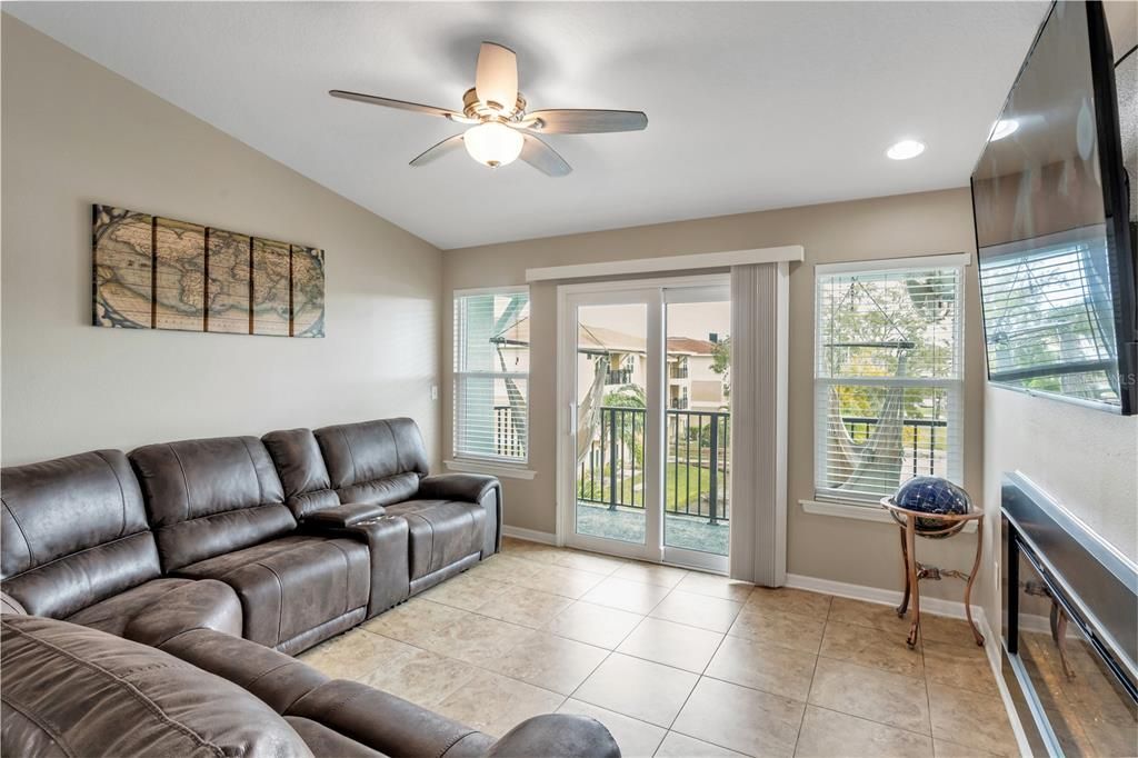 Plenty of seating, Sliding doors leading to balcony that overlooks the pond