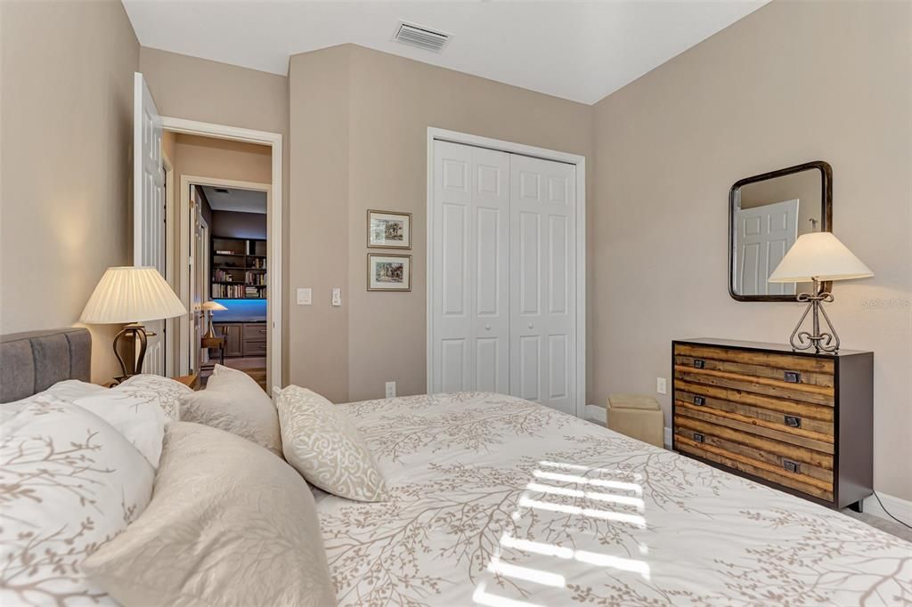 Bedroom 3 features a queen bed, and ample space for mobility.