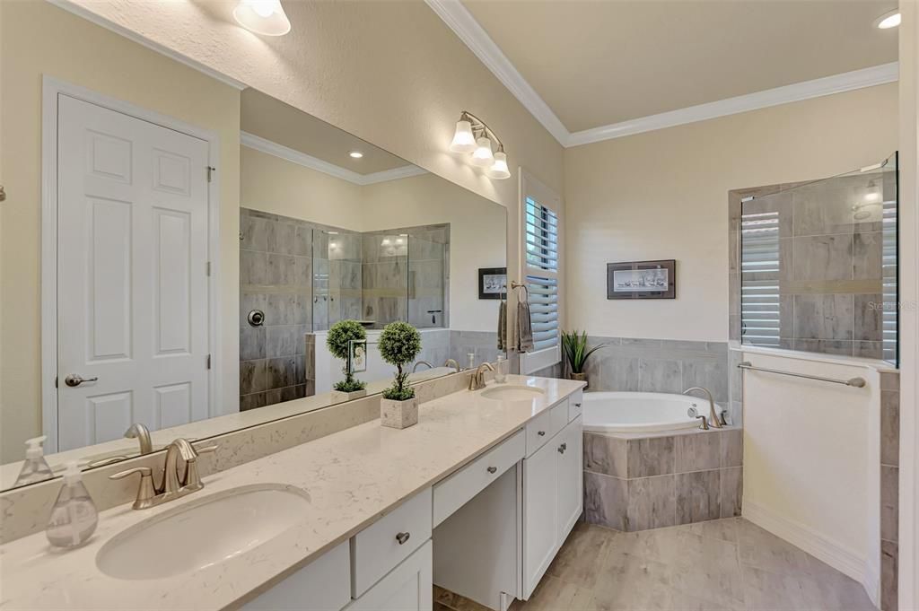 The Ensuite bath has a makeup counter, dual sinks, a soaking tub and walk in shower with a private water closet.