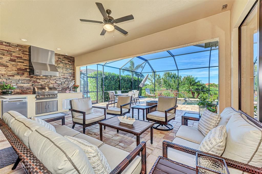 The lanai has a storm smart screen and outside kitchen.