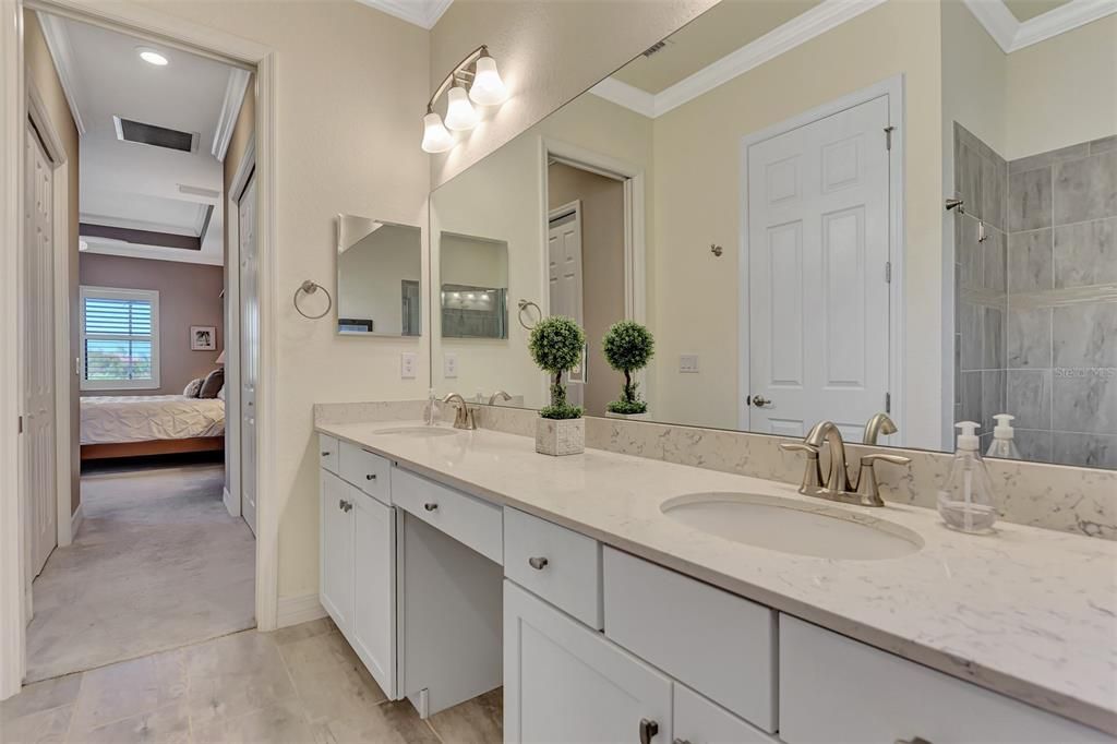 The Ensuite bath has a makeup counter, dual sinks, a soaking tub and walk in shower with a private water closet.