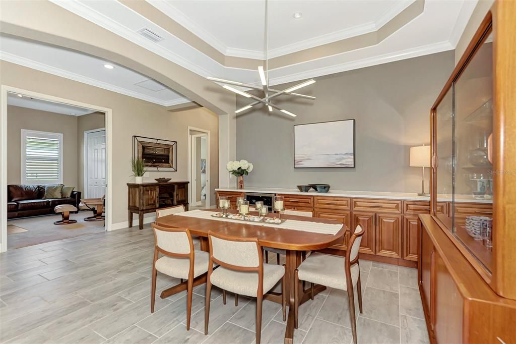 The dining room has built in serving/storage with a wine cooler to store your favorite VINO.