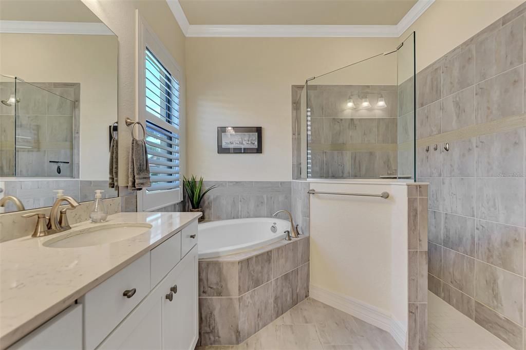 The Ensuite bath has a makeup counter, dual sinks, a soaking tub and walk in shower with a private water closet.