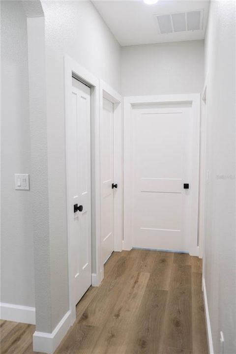 Linen closet and hall to bedrooms