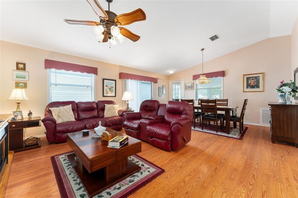 LIVING AREA HAS RECLINER SOFA AND RECLINER LOVESEAT AND HAS PLENTY OF NATURAL LIGHT THROUGH WINDOWS AND SLIDERS