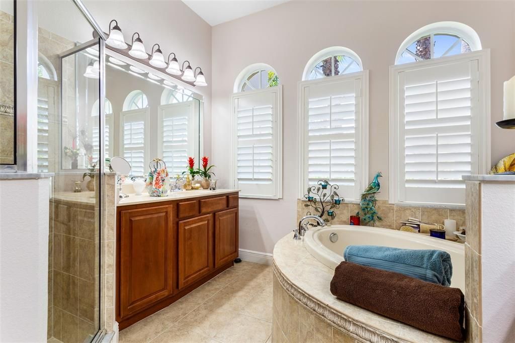 Master bathroom and dual vanity sinks with Garden tub