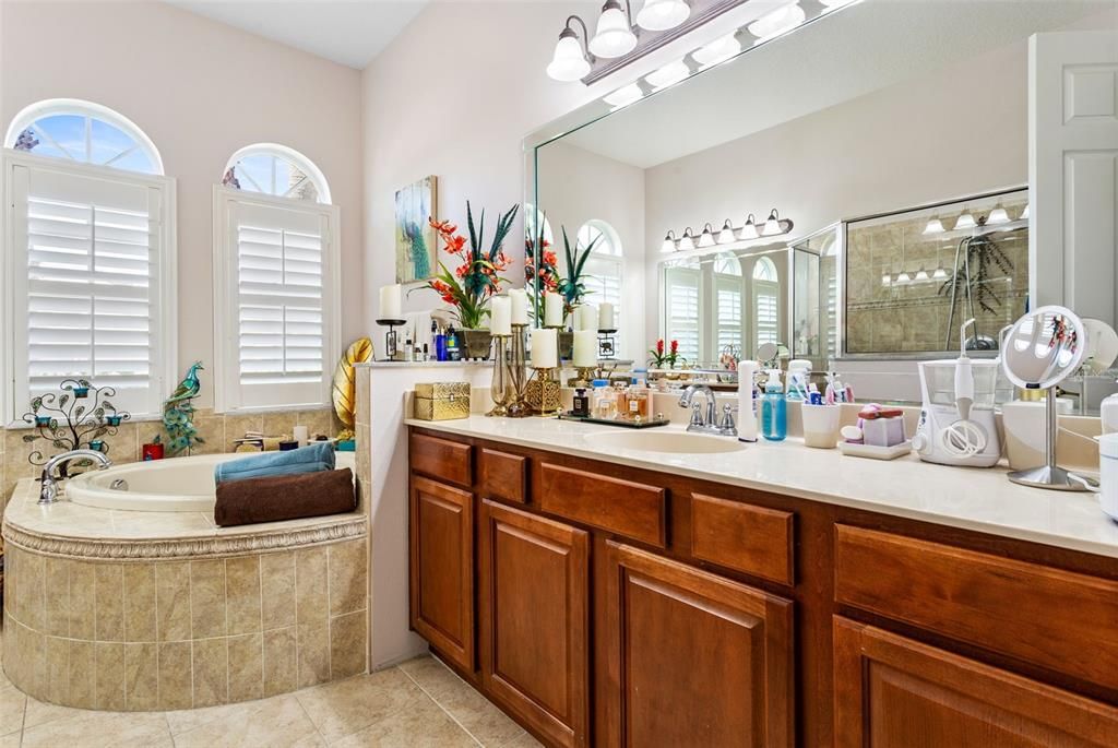 Master bathroom and dual vanity sinks with Garden tub