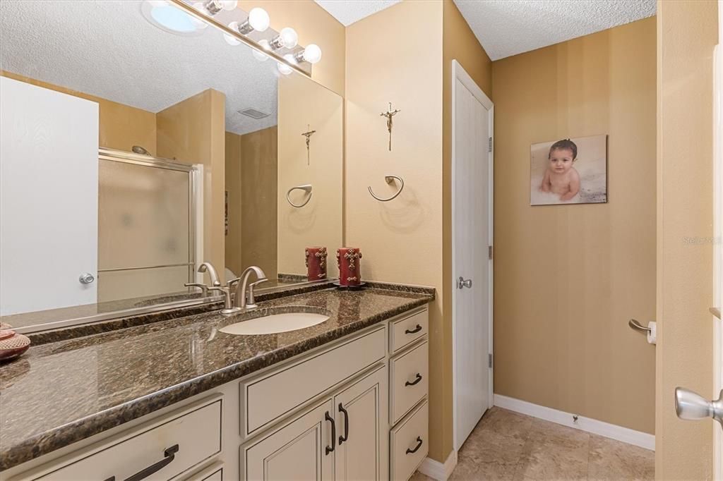 Primary Bathroom - Large Countertop and Wide Mirror