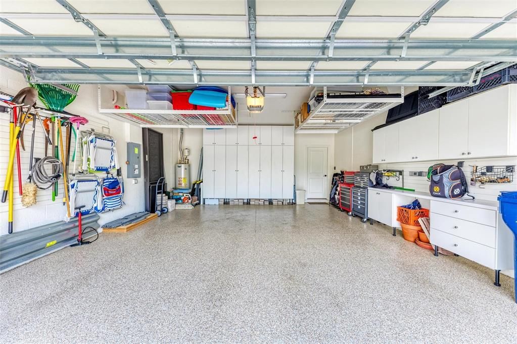 Oversized Garage 20X24 Epoxy flooring built in shelves and shelving slats along with loft storage