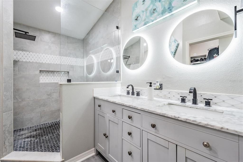 Updated master bath with walk-in shower and stone vanity