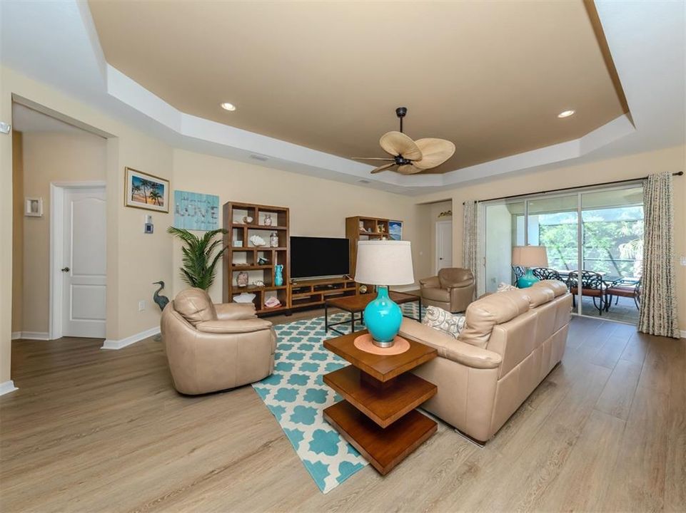 GREAT ROOM SHOWING DOORS TO PRIMARY AND SECOND BEDROOMS