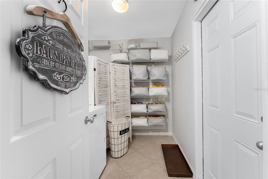 Indoor Laundry Room with Great Wall Storage and Tile Floors.