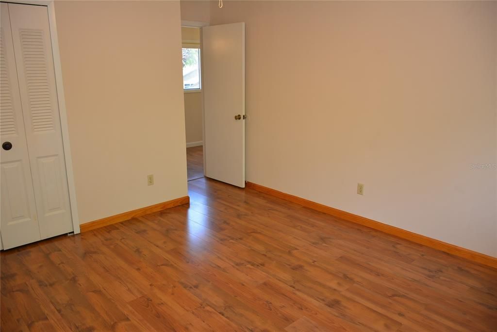 Bedroom 3 - 13 x 12  is freshly painted and has laminate flooring.