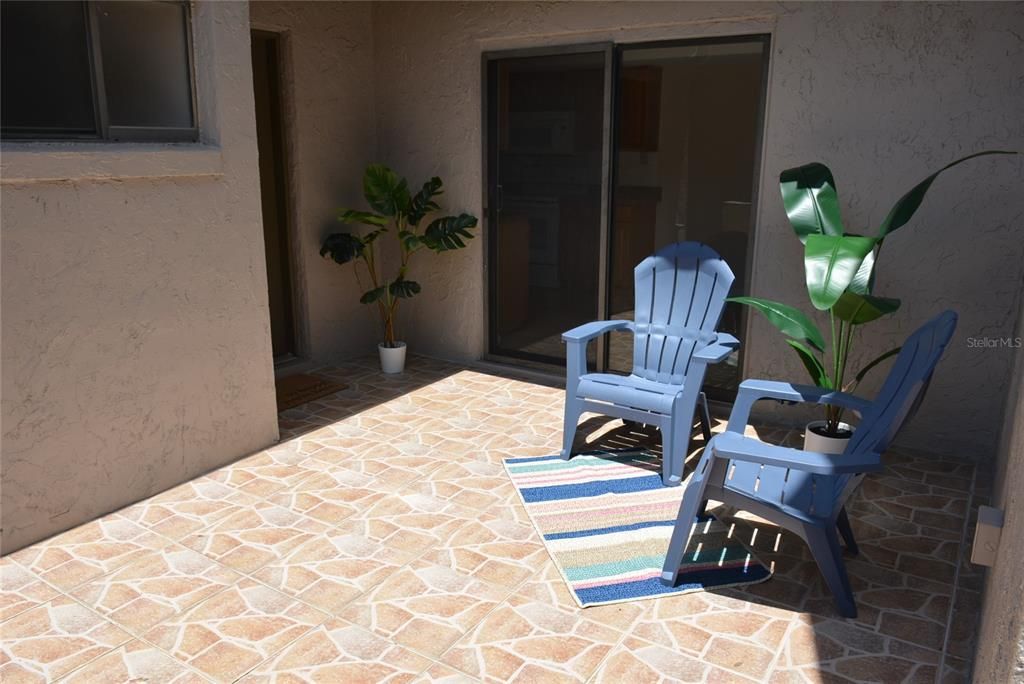 Relax in your private walled and tiled courtyard.  Visitors enter the home through the front door.  Sliding doors provide easy access to the kitchen.