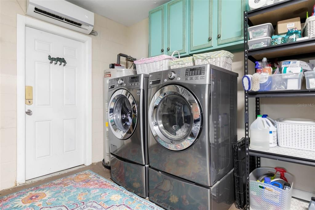 Laundry within air conditioned garage.