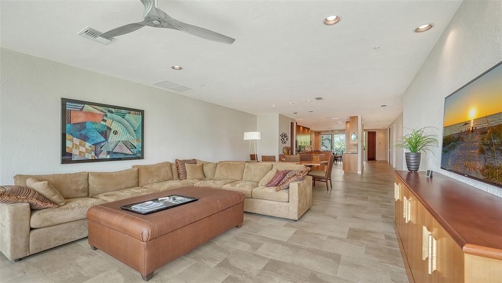 View looking back towards the front door and large kitchen.