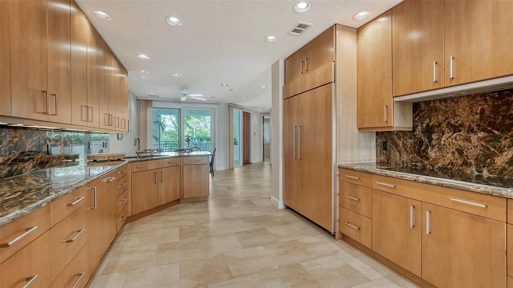 Another view of the stunning kitchen, looking towards the breakfast nook and front patio.