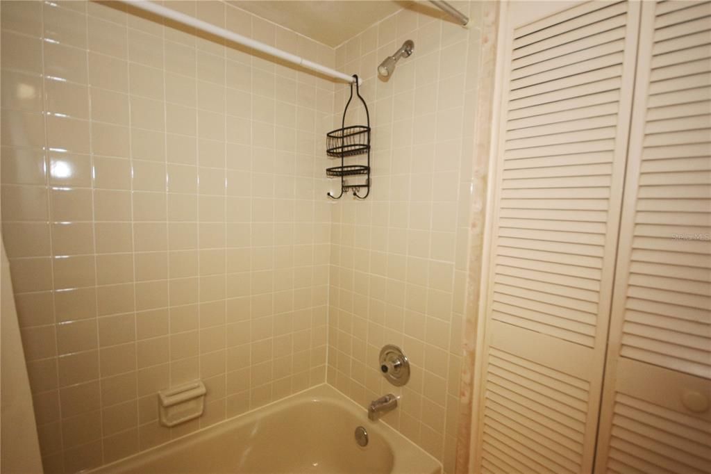 Guest Bath Tub-Shower Showing Laundry Closet
