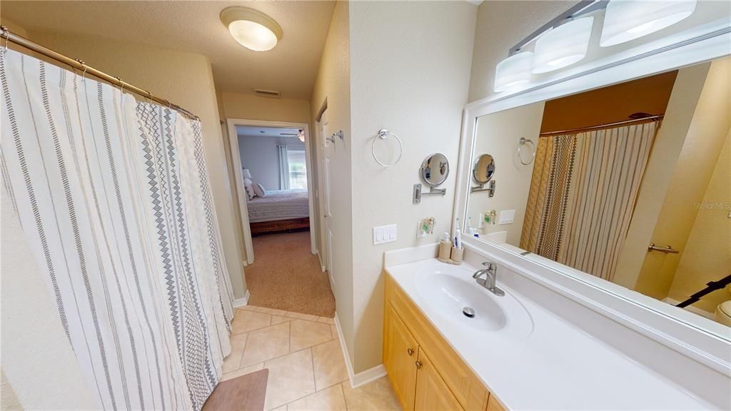 En-Suite Bathroom w/Single vanity, toilet & walk-in shower
