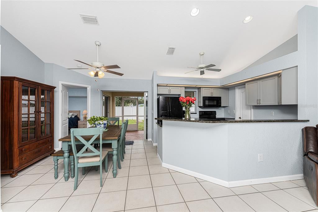 Dining area and kitchen with large breakfast bar!