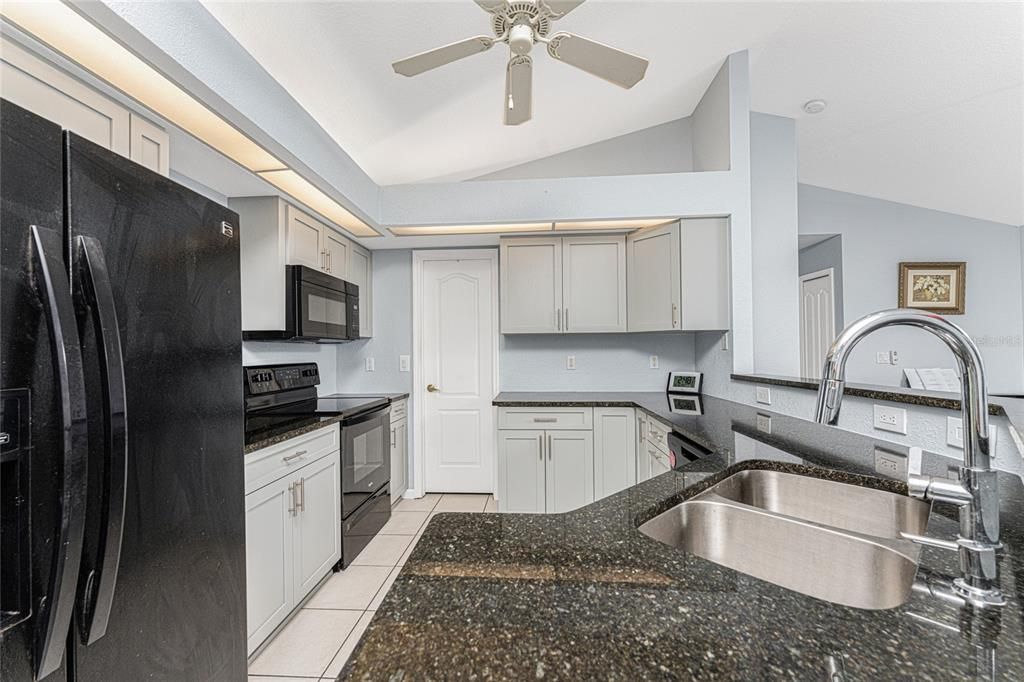 Kitchen has new cabinetry and granite counter tops!