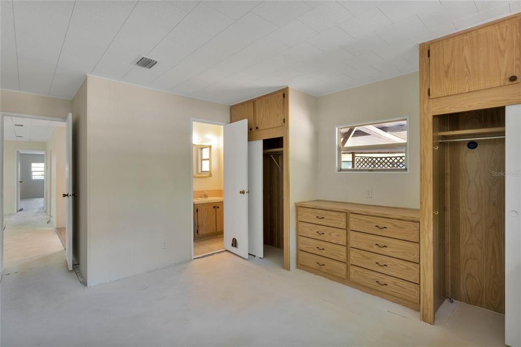 Master Bedroom featuring lots of closet space