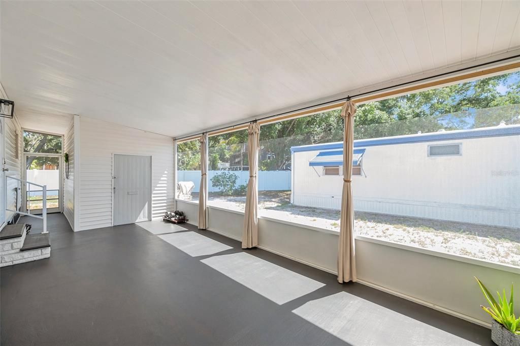 Large screen porch with storage room in back