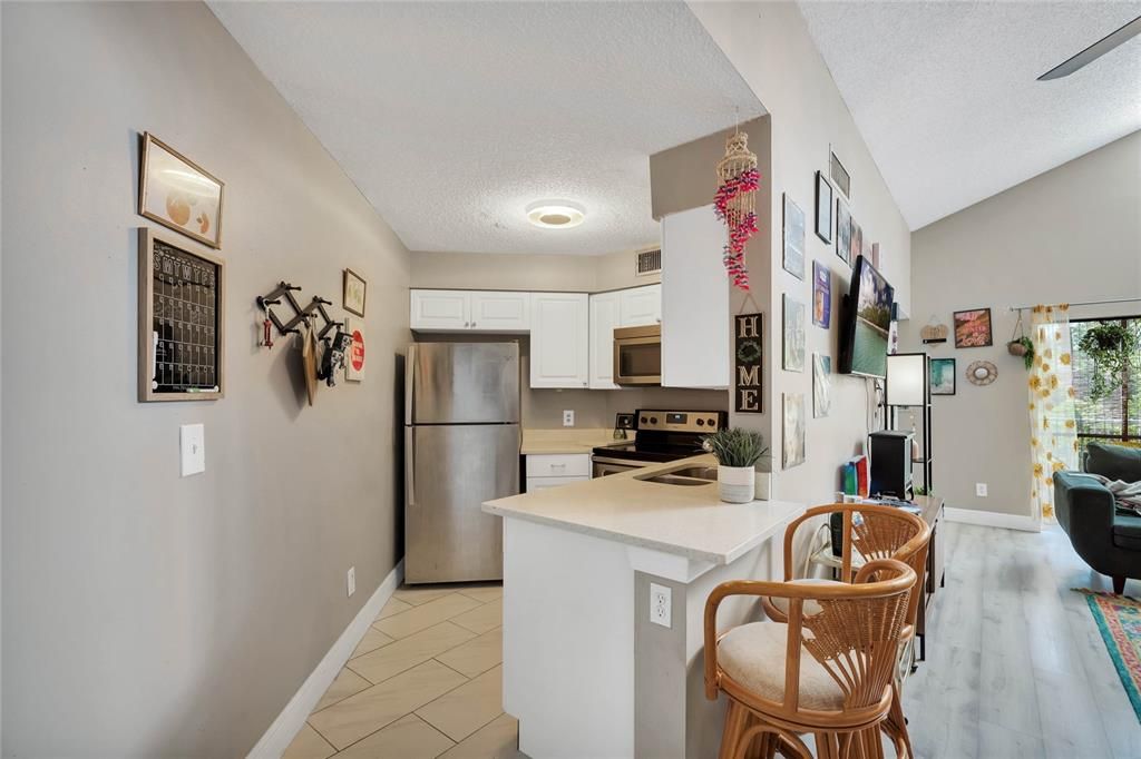 Updated kitchen with stainless steel appliances and quartz tops with soft close drawers