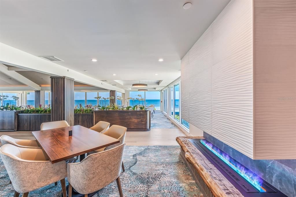 Second Floor Dining Room with electric blue fireplace.