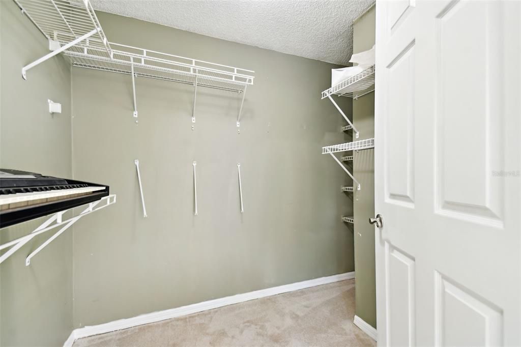 primary bedroom walk-in closet