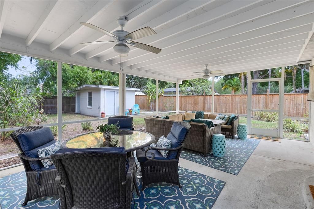 Wonderful screened back porch offers another space to enjoy
