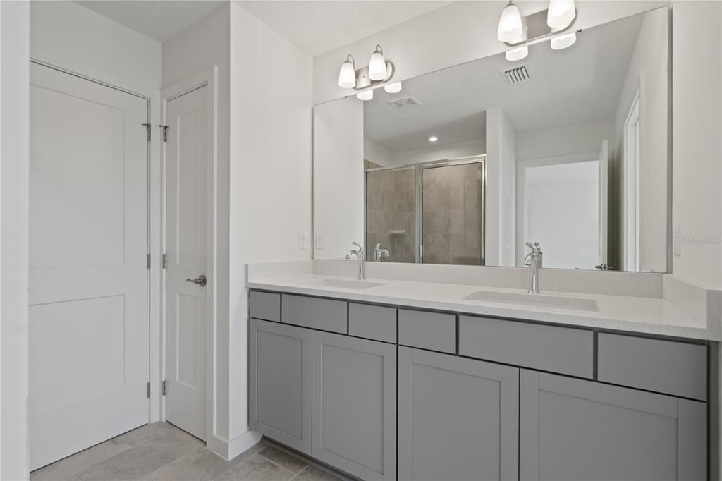 Primary bathroom with a dedicated linen closet.