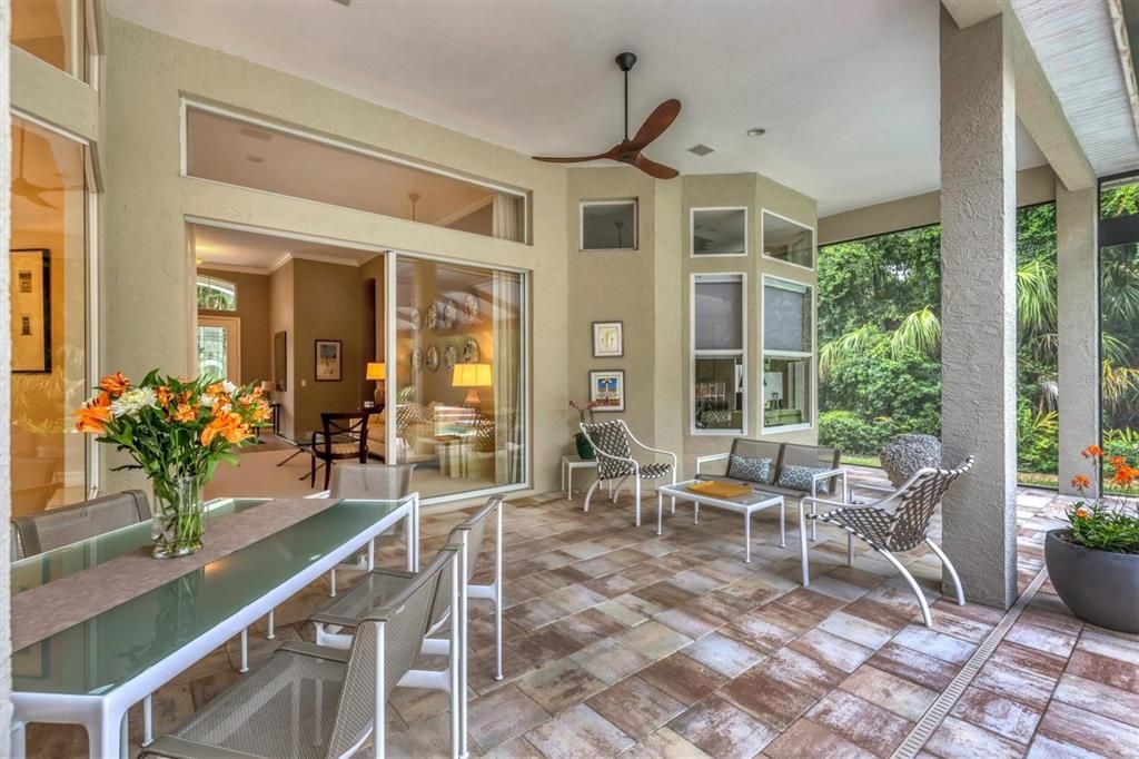 second covered lanai area with entertaining space and tranquil preserve views