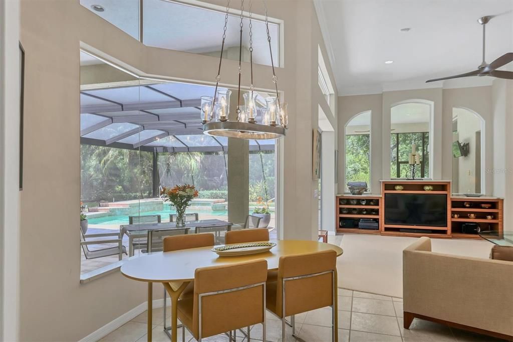 Aquarium glass kitchen eating area with fabulous view of the pool, spa and preserve