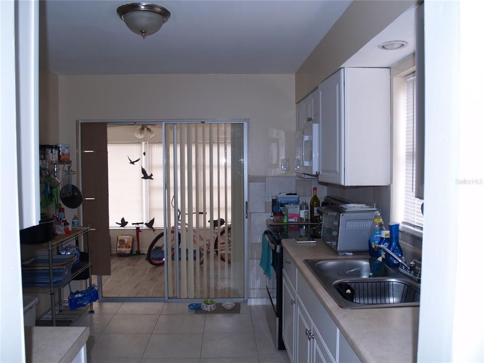 Right Side Unit  Kitchen to Enclosed Lanai