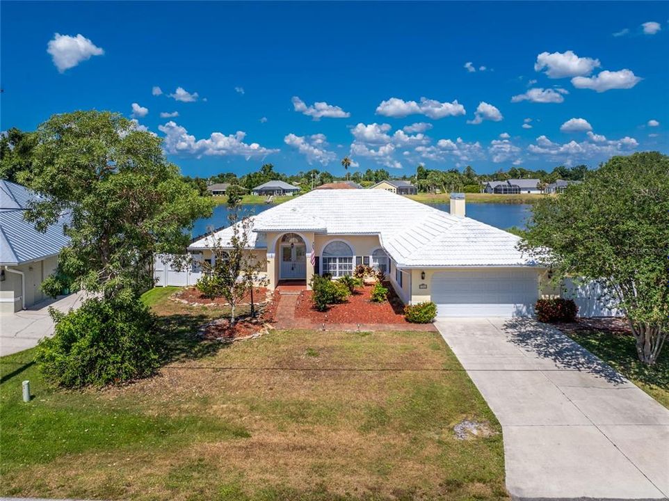 Welcome to this spacious 4 bedroom/2 bath/2 car garage LAKEFRONT POOL HOME!