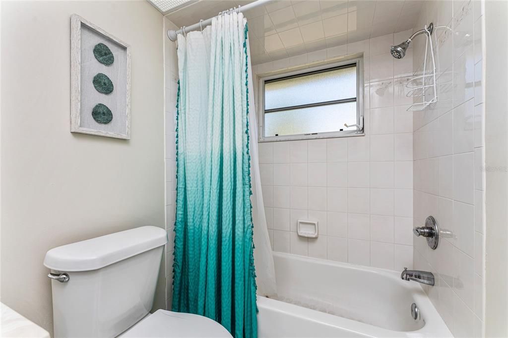 Guest Bath Has a combo Tub/Shower.