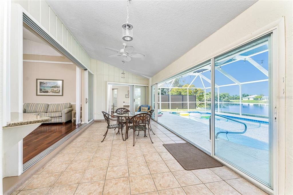 Florida Room has Tiled Flooring And Sliding Glass Doors To The Pool Area.