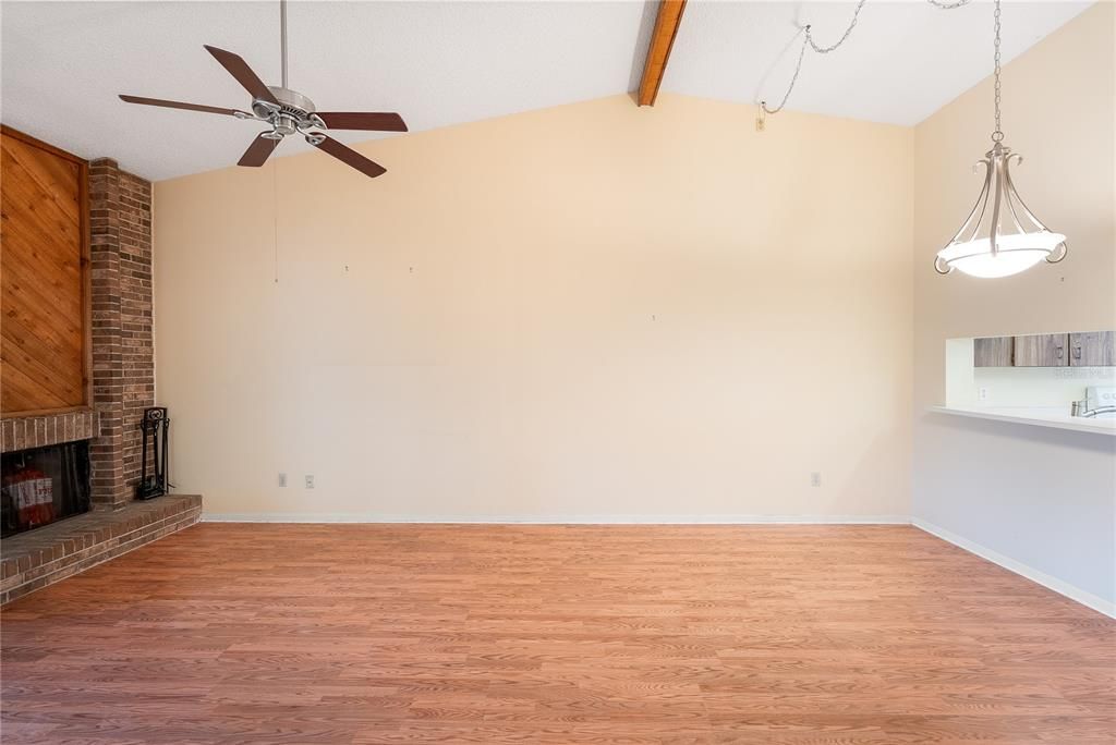 Fireplace & updated floors, vaulted ceilings