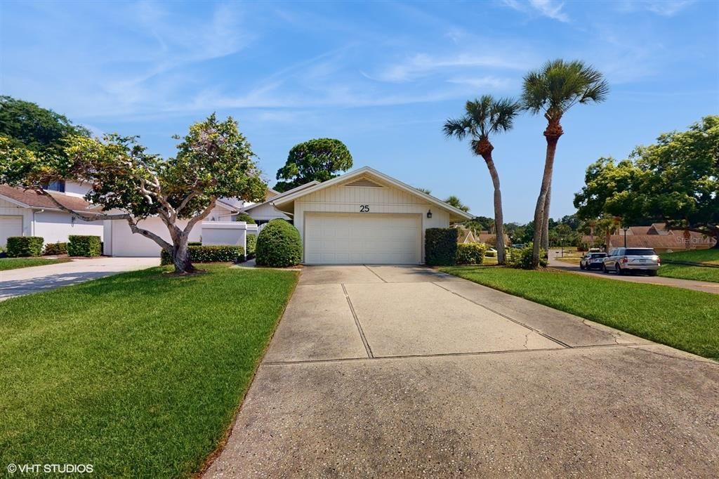 Private Drive w/ 2 Car Garage