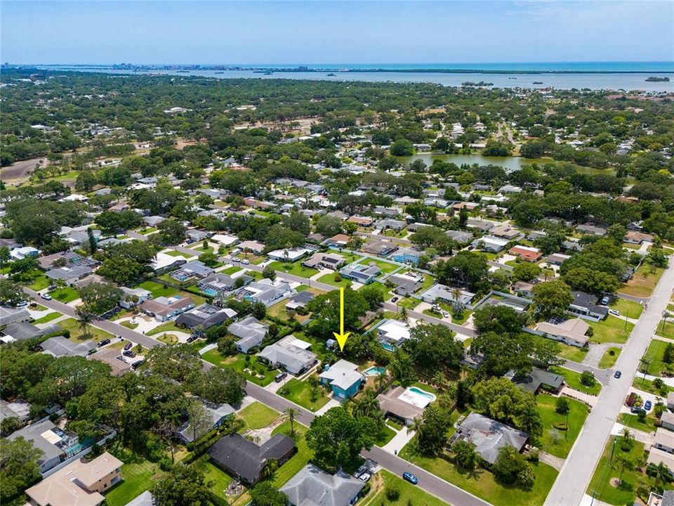 This aerial view of the home is looking Southwest towards the Gulf Of Mexico, Intracoastal Waterway and you can also see Beautiful Lake Saundra, the heart of Fairway estates on the right.