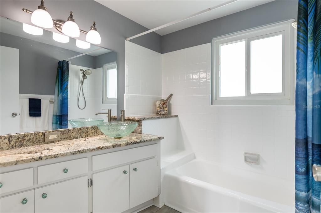 This Full Bathroom is convenient to both Bedrooms and features a tub/shower combo and nice sized single sink vanity.