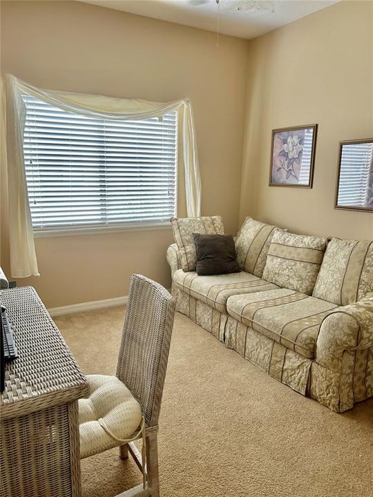 Secondary bedroom being used as a study.