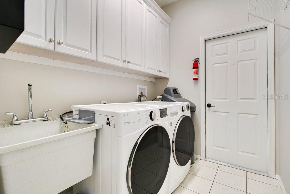 Laundry Room with 42’ cabinets and a utility sink