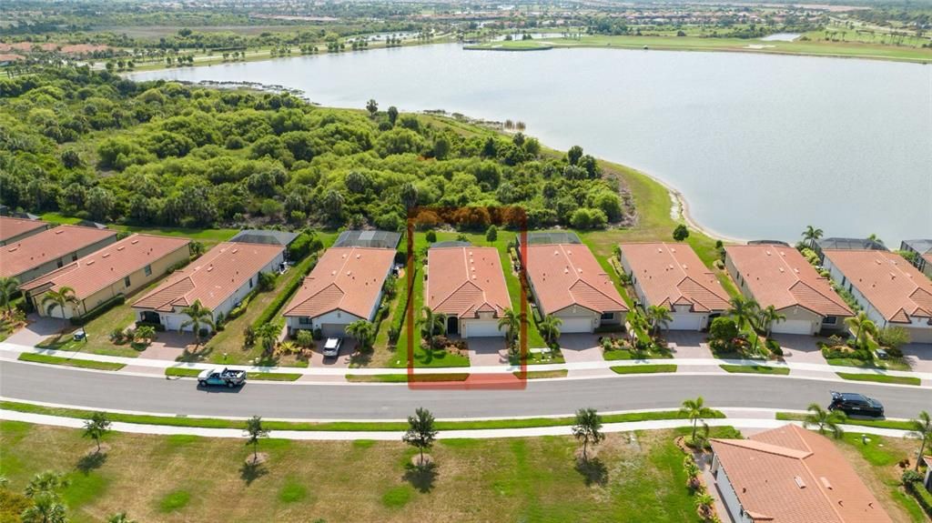 Overhead photo showing preserve and partial water view as well as no neighbors in front for added privacy.